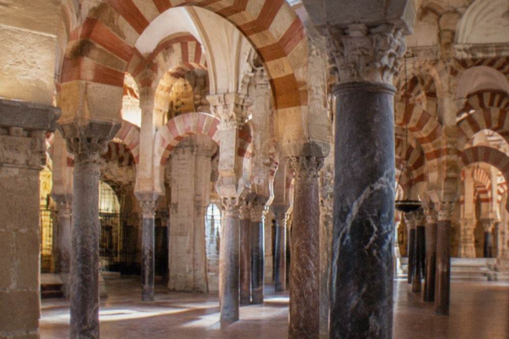 Flower-filled patios and narrow white lanes in the historic center of Cordoba