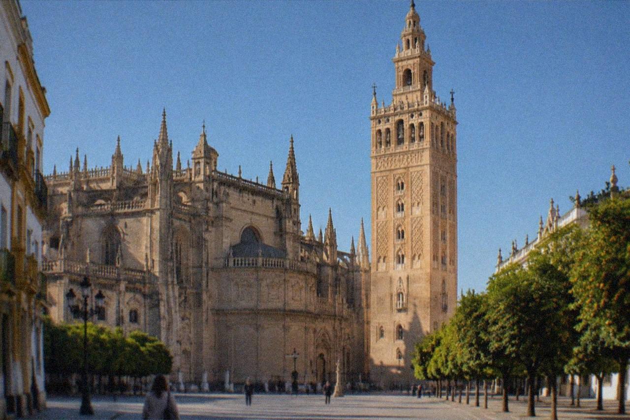 The Giralda tower rising above Seville Cathedral under a clear Andalusian sky