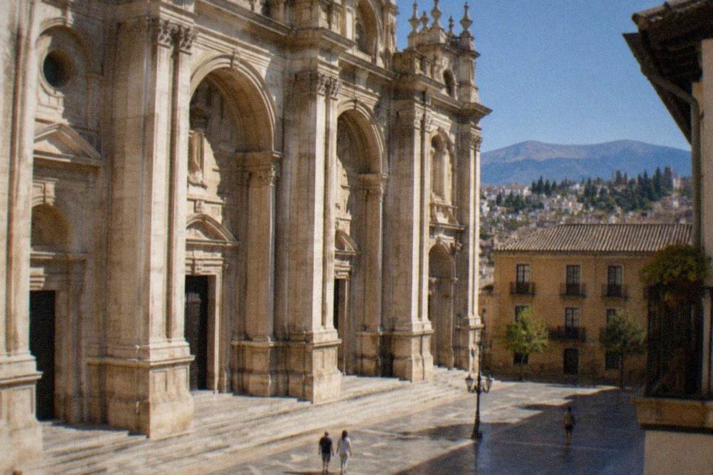 The Renaissance interior of Granada Cathedral with its circular nave and high white columns