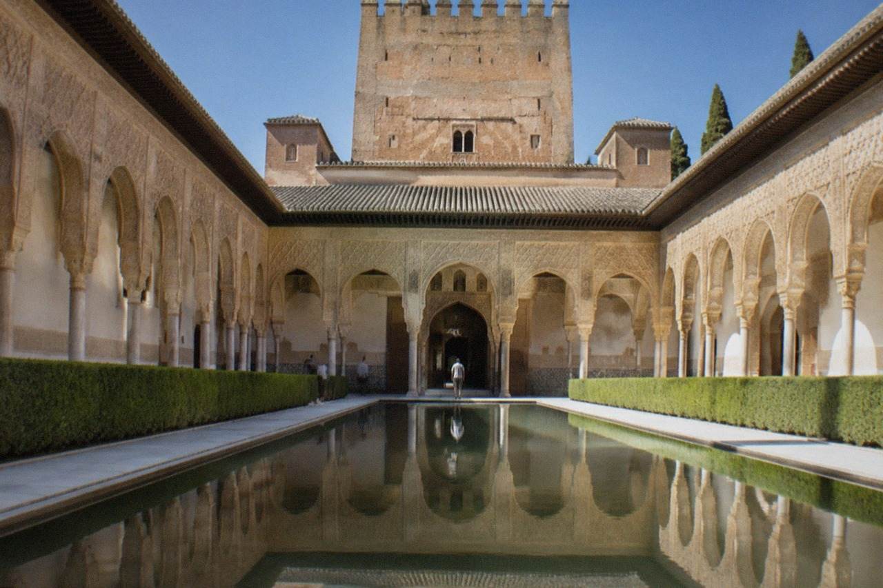 The Nasrid Palaces of the Alhambra seen from a garden terrace above Granada