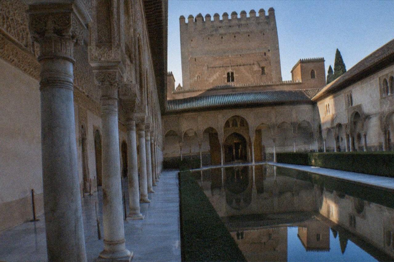 The ornate arched courtyards of the Nasrid Palaces inside the Alhambra in Granada