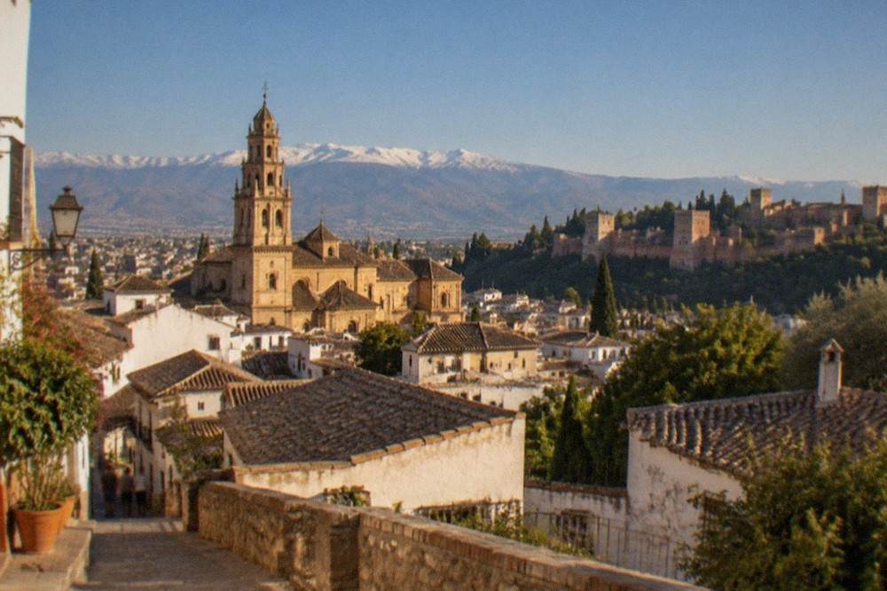 The bell tower of Cordoba's historic mosque-cathedral rising above old town rooftops