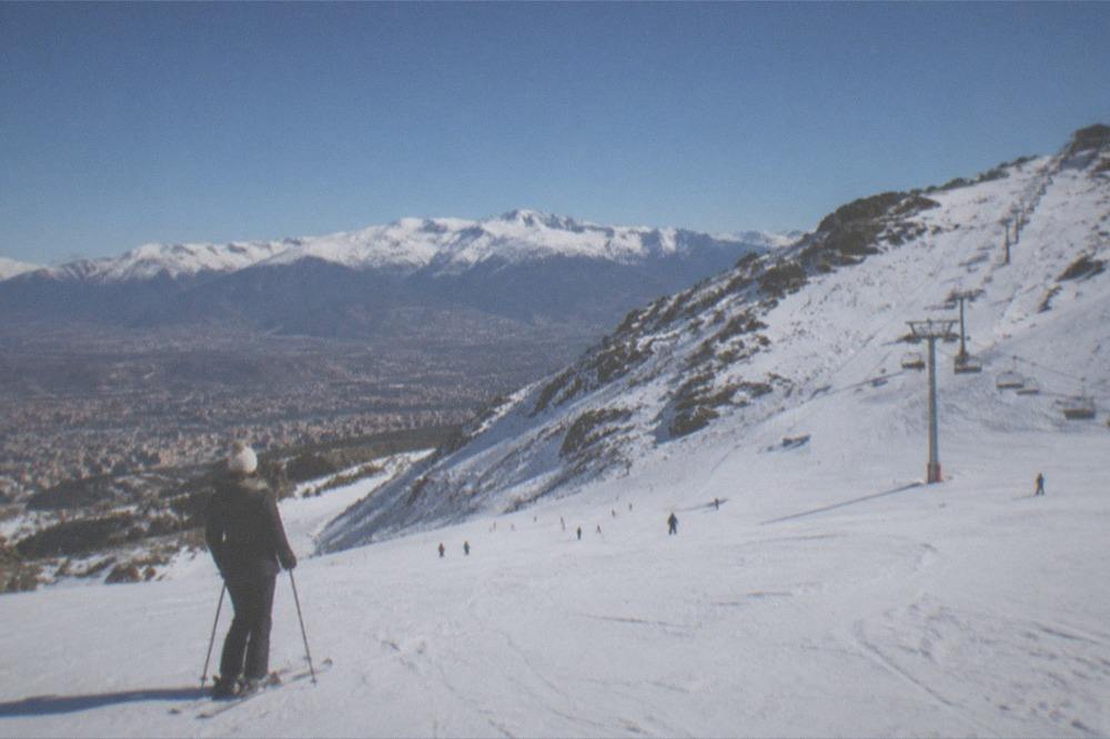 The Sierra Nevada mountains with snow visible above the rooftops of Granada