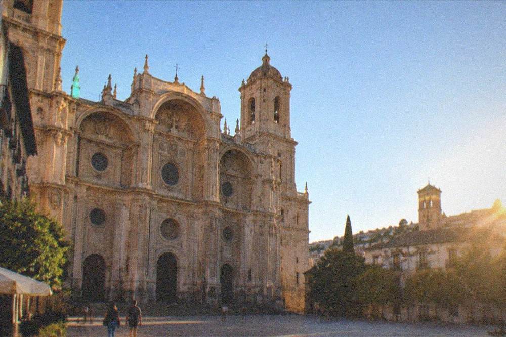 Evening light on the cathedral towers seen from a rooftop terrace