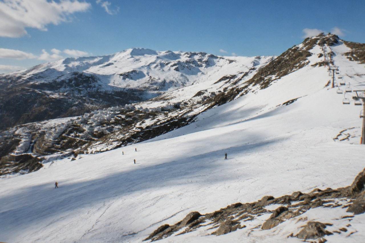 White mountain villages below the snowy peaks of the Sierra Nevada near Granada