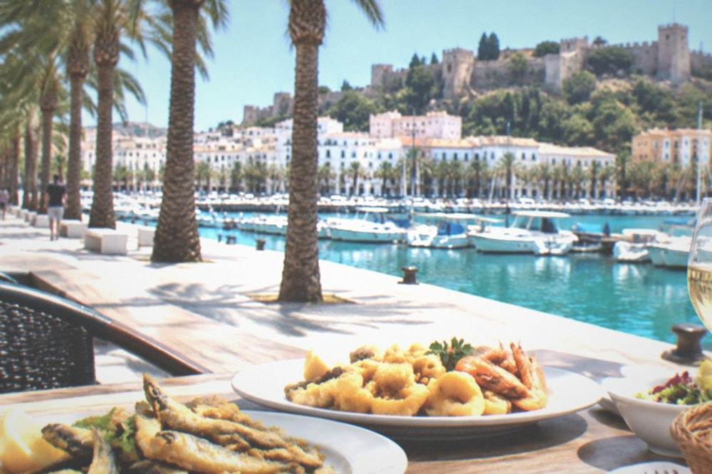 Fresh fried fish and seafood plates served on an outdoor terrace table