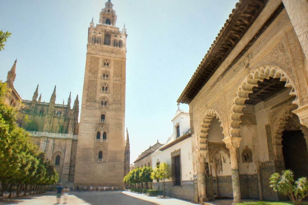 Ornate carved arches and tiled courtyards inside the Real Alcazar of Seville