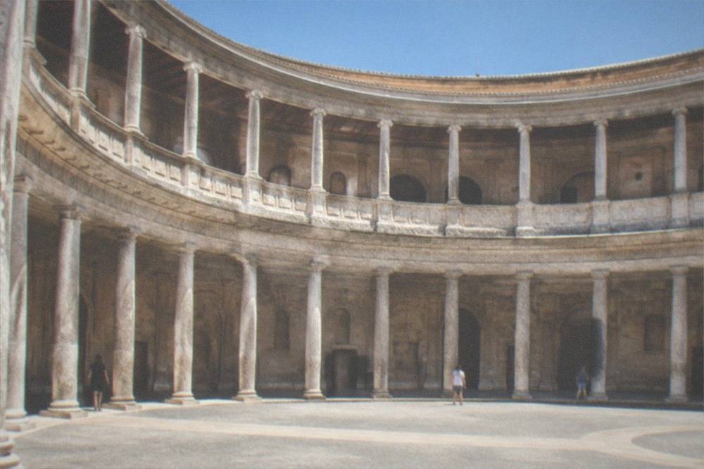 The circular courtyard inside the Palace of Charles V with its two tiers of columns