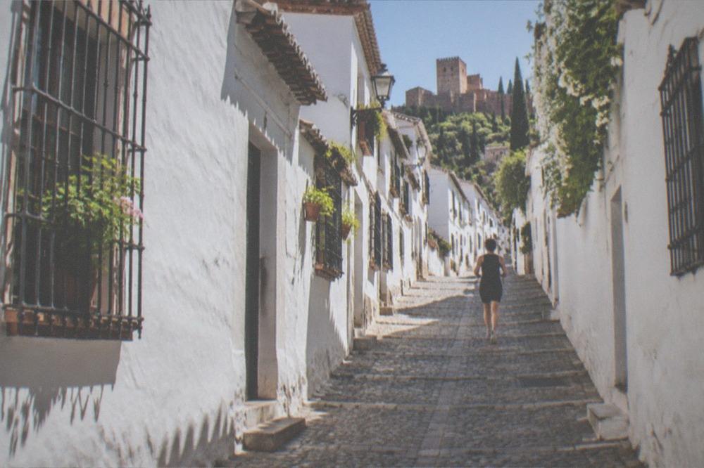 The narrow cobbled streets of the Albaicin quarter in Granada with whitewashed houses