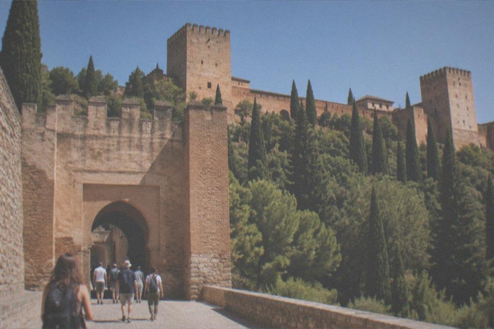 The Gate of Justice entrance to the Alhambra with visitors arriving in the morning