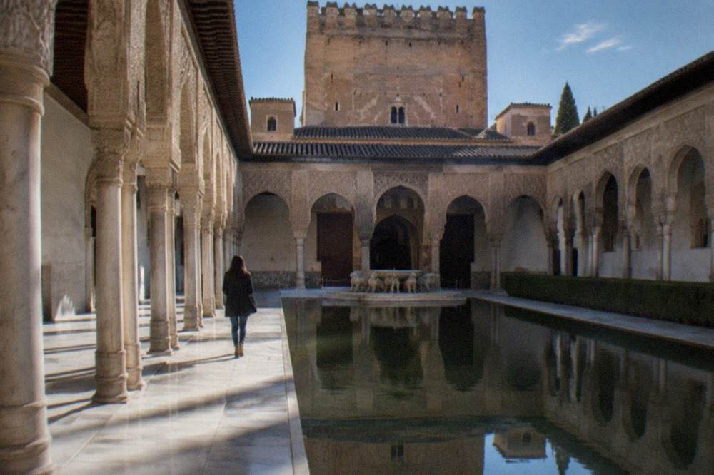 The Courtyard of the Lions inside the Nasrid Palaces with its marble columns and fountain