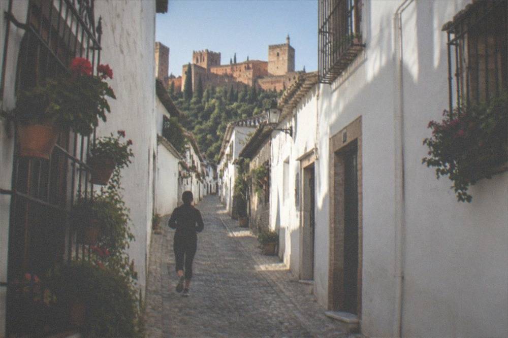 Narrow whitewashed streets and flower pots in the Albaicin quarter of Granada