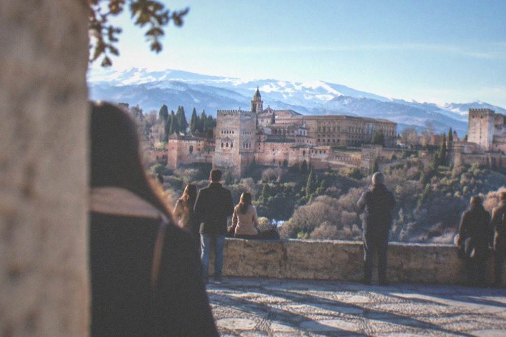 Crowds gathered at the Mirador de San Nicolas watching sunset behind the Alhambra