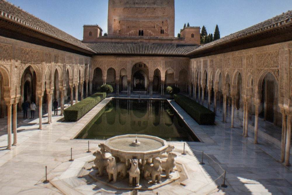 The Court of the Lions in the Nasrid Palaces with its marble columns and central fountain