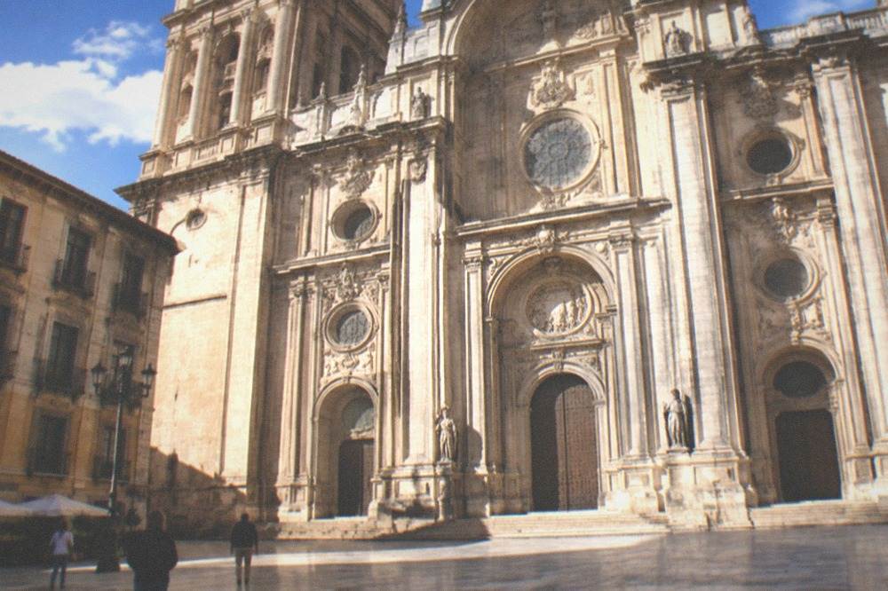 The grand baroque facade of Granada Cathedral seen from the Plaza de las Pasiegas