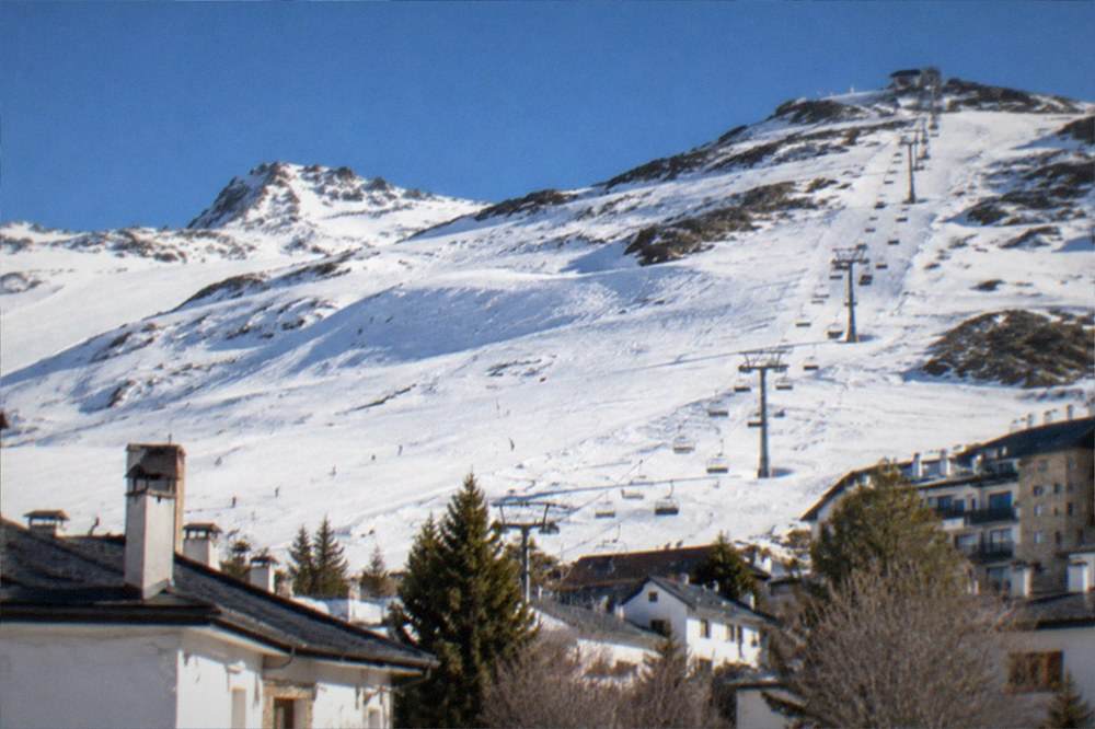 The Sierra Nevada mountains with fresh snow seen above the rooftops of Granada
